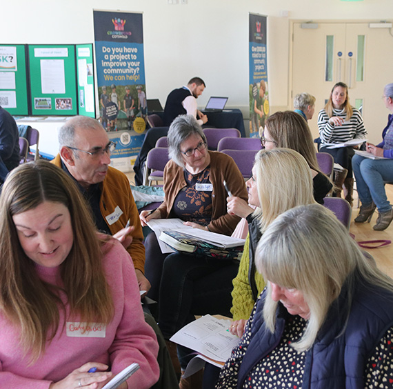 People talking and working together at a community-led planning session