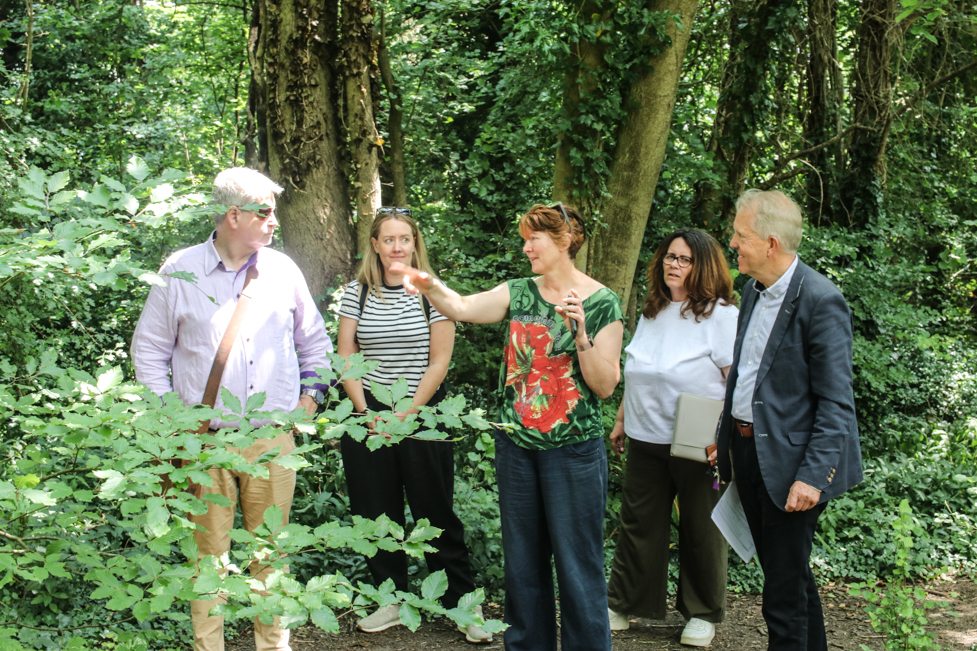 Villagers from Highnam show the Gloucestershire Village of the Year judges work that they have been doing in local woodland