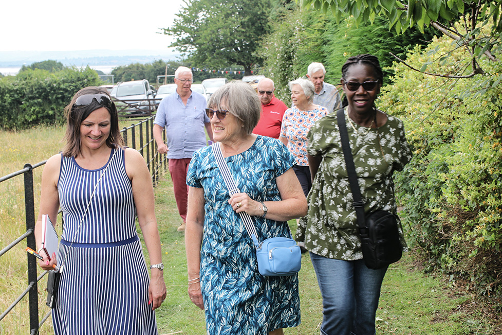 Hayley Coombs (left of photo) during a Village of the Year judging visit last year.