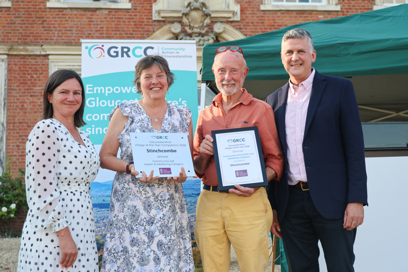 Representatives of Stinchcombe receive their prize from two of the competition judges