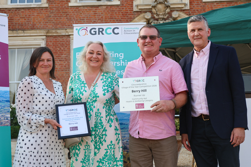 Representatives of Berry Hill receive their prize from two of the competition judges