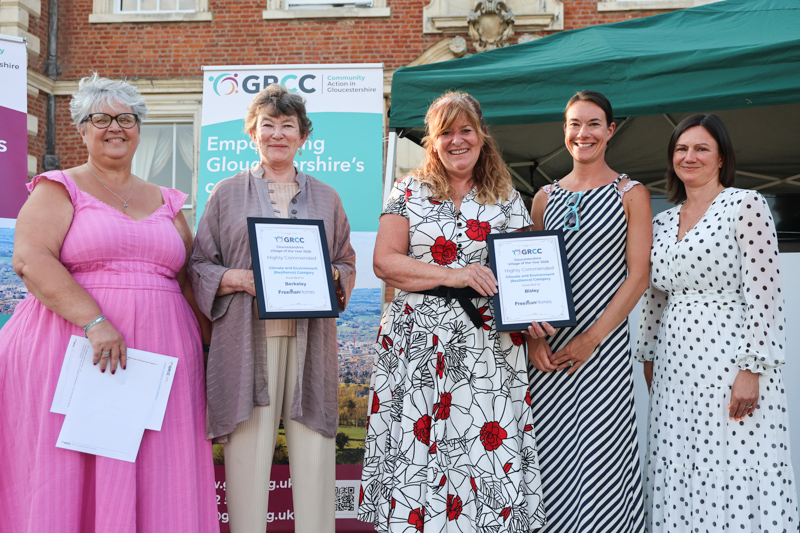 Representatives of Berkeley and Bisley receive their prize from two of the competition judges
