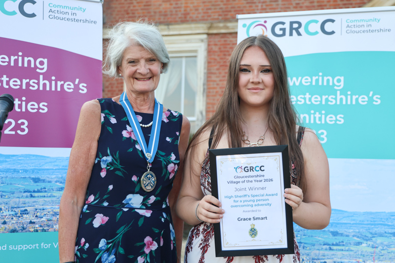 Grace Smart receives her prize from Gloucestershire High Sheriff, Dame Fiona Reynalds,