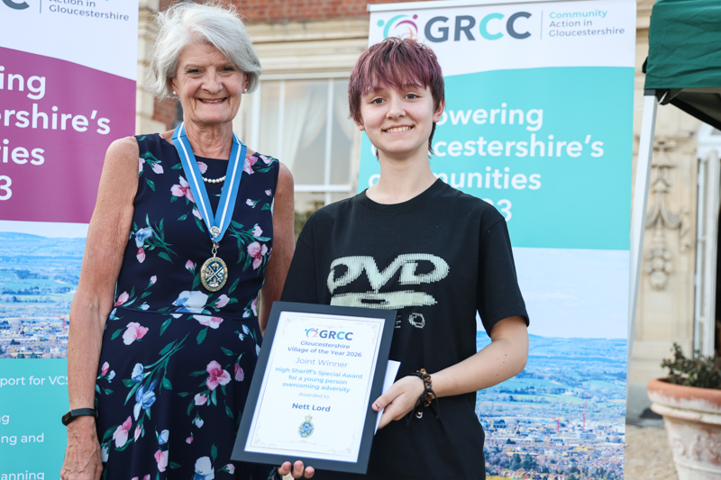 Nett Lord receives her prize from Gloucestershire High Sheriff, Dame Fiona Reynalds,